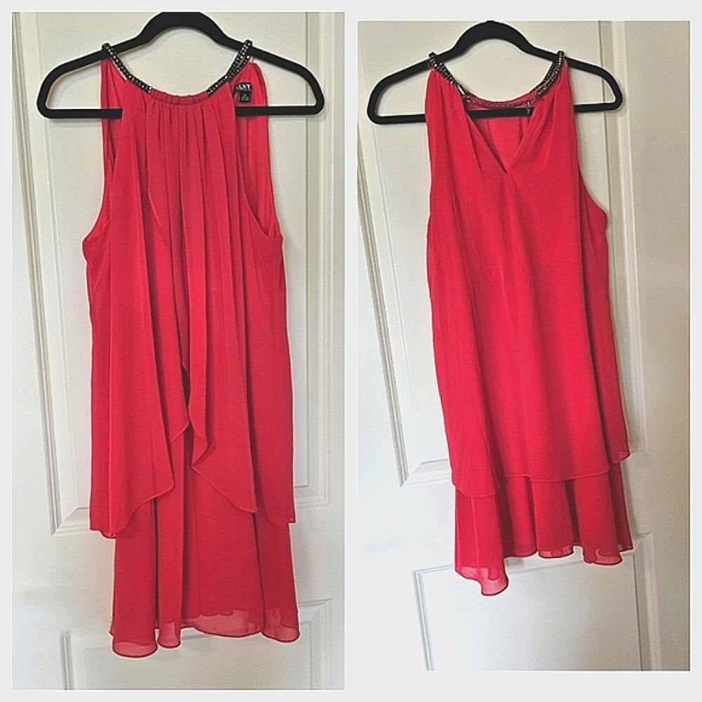 Charming pink dress from SLNY is fluffy and features an adjustable neckline